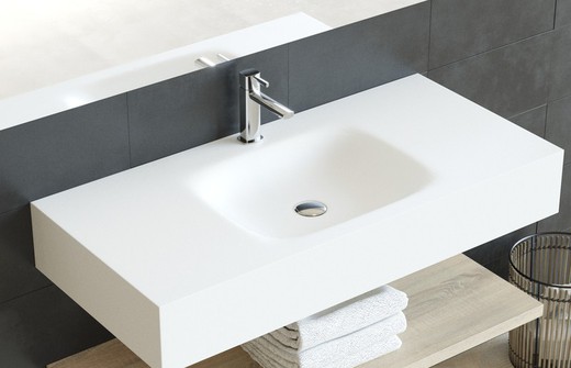 Solid countertop with centered Asthon basin, skirt and supports